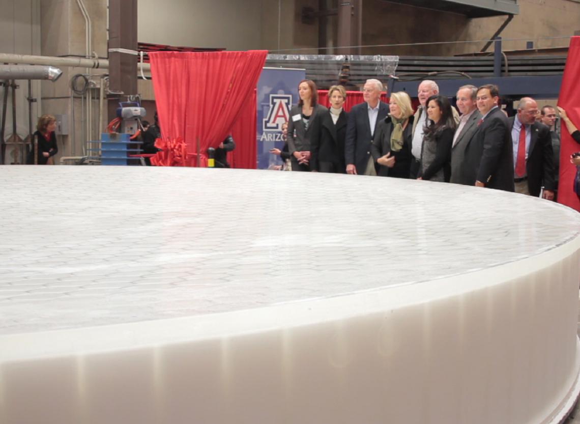 UA President Ann Weaver Hart and guests join in unveiling GMT mirror number 3.